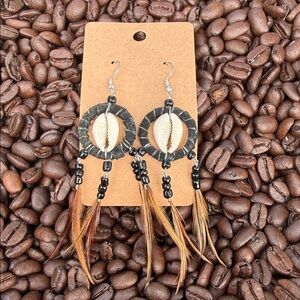 Handcrafted Cowrie Shell Hoop Earrings with Brown Feather Accents